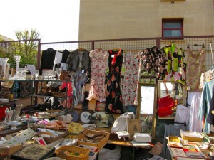 Stand at Marché aux Puces de la Porte de Vanves selling vintage clothing