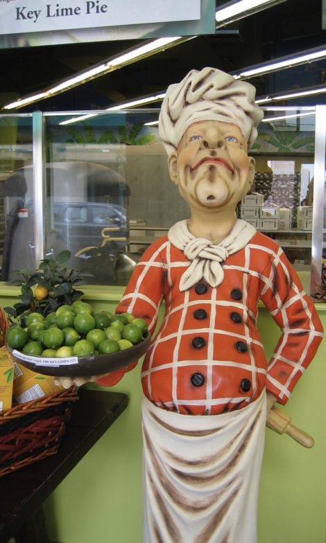 Statue of chef holding a platter of key limes.