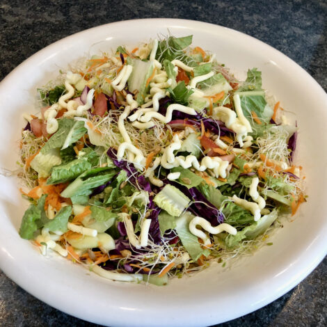 Sunshine Inn salad in large white bowl.