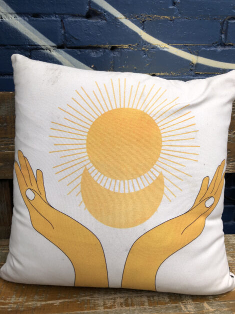 Sunshine motif on throw pillow at Edobox.