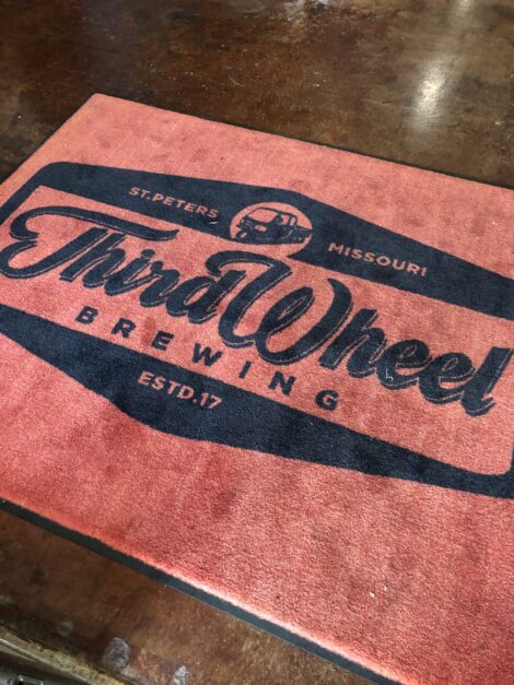 Floor mat from Third Wheel Brewing