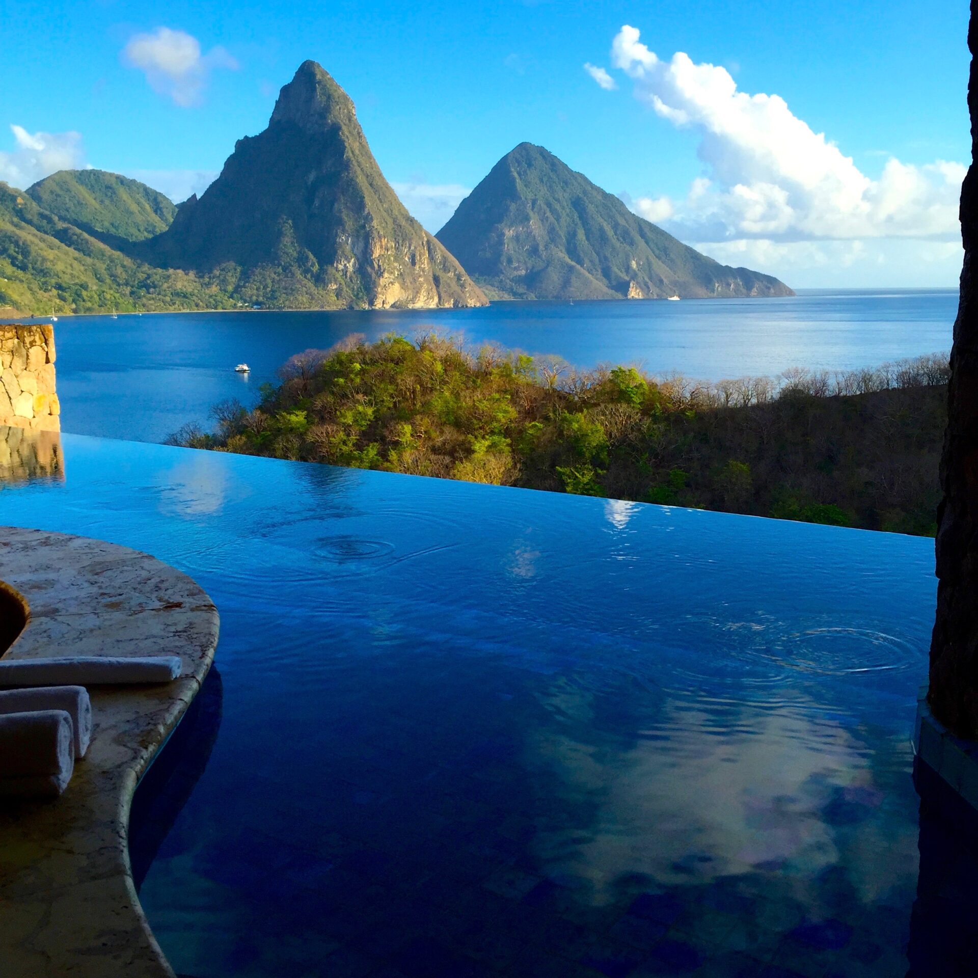 Sitting at the ledge of the infinity pool at Jade Mountain overlooking the Caribbean