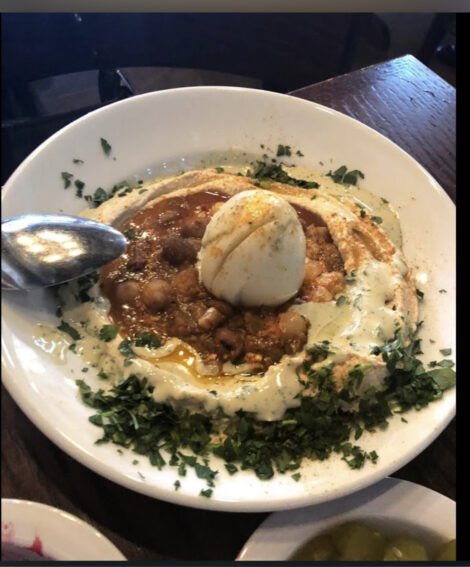 Ta-eem's Hummus Fava Beans (Ful) with hardboiled egg garnish.