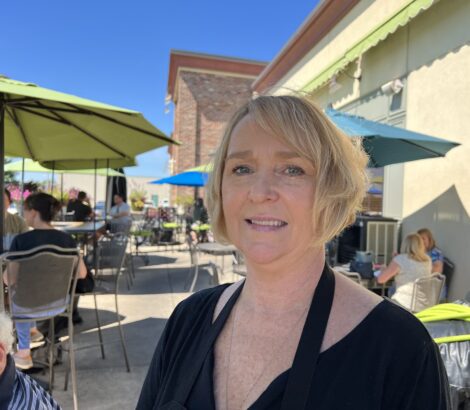 Portrait of Hallie Pierceall on the patio of D'Arcy's Pint.