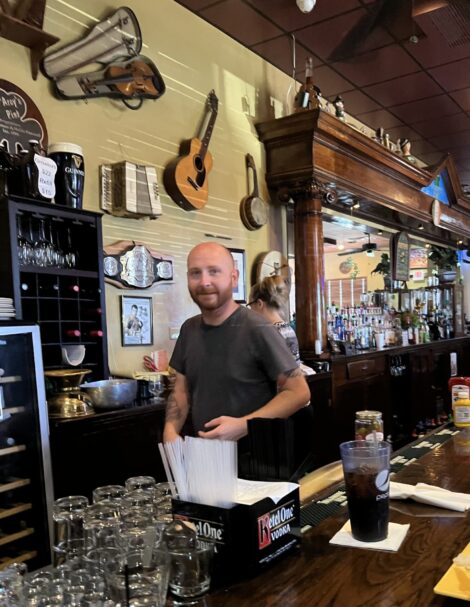 T. J. Pierceall behind the bar at D'Arcy's Pint