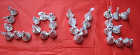 The word love written in chocolate kisses
